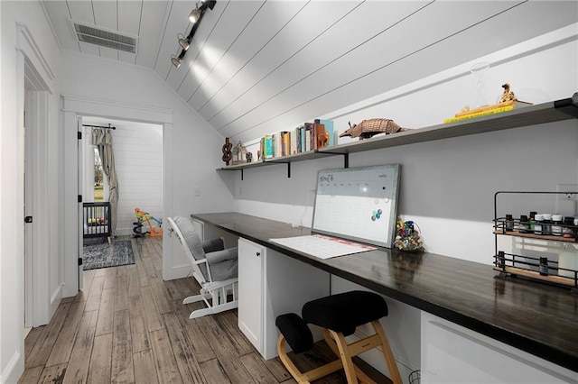 29 Highpoint Ridge Ct, Ellijay, GA 30536 - office area featuring wood finished floors, visible vents, vaulted ceiling, built in study area, and rail lighting