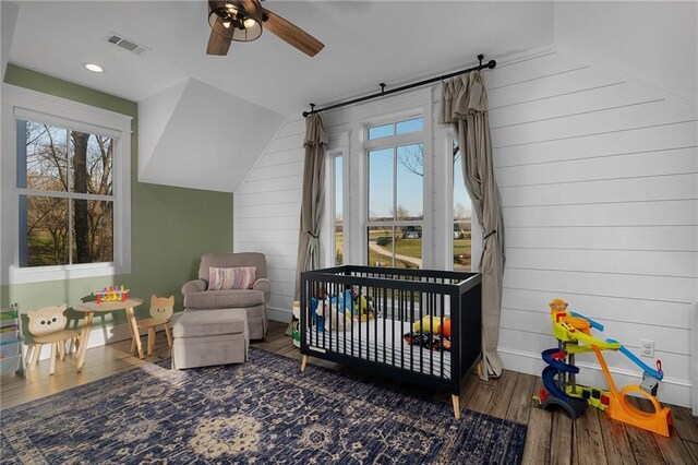 29 Highpoint Ridge Ct, Ellijay, GA 30536 - bedroom with visible vents, wood walls, wood finished floors, a nursery area, and baseboards