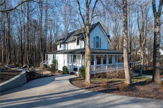 29 Highpoint Ridge Ct, Ellijay, GA 30536 - farmhouse inspired home featuring covered porch and driveway