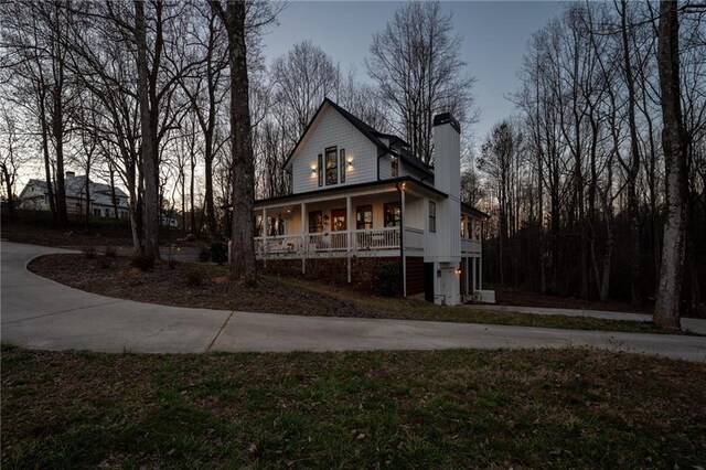 29 Highpoint Ridge Ct, Ellijay, GA 30536 - view of front facade featuring a porch and a chimney