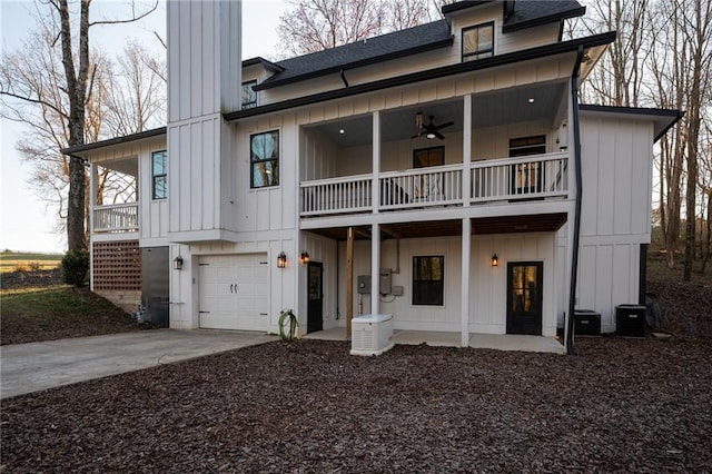 29 Highpoint Ridge Ct, Ellijay, GA 30536 - rear view of property with driveway, central AC unit, board and batten siding, and roof with shingles
