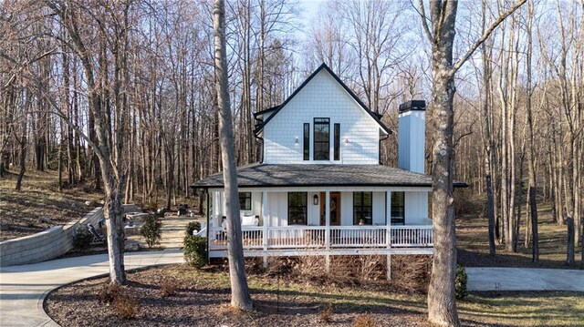 29 Highpoint Ridge Ct, Ellijay, GA 30536 - view of front of house featuring covered porch, concrete driveway, and roof with shingles