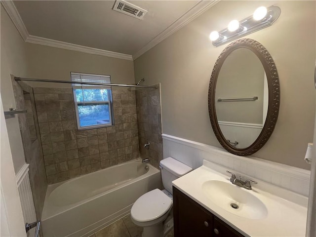 full bathroom with vanity, tiled shower / bath, ornamental molding, and toilet