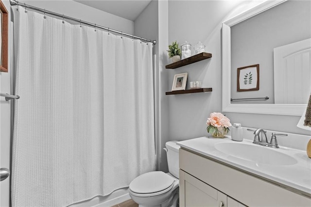 full bathroom featuring toilet, vanity, and shower / bath combo with shower curtain