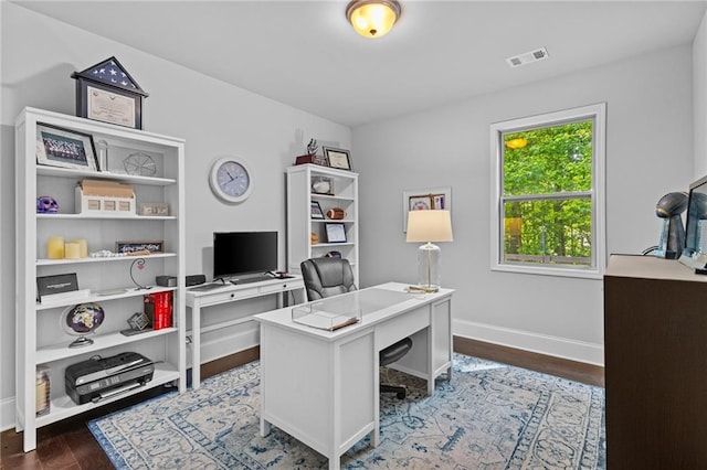 office space featuring baseboards and dark wood-style floors