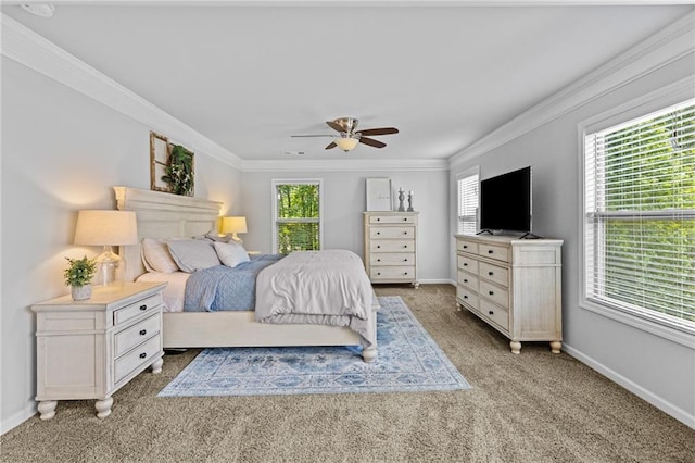 bedroom featuring crown molding, light carpet, baseboards, and ceiling fan
