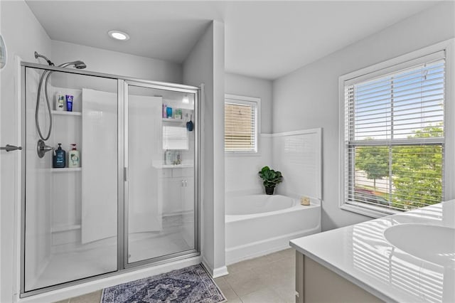 full bathroom with a shower stall and healthy amount of natural light