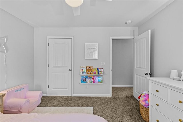 carpeted bedroom featuring ceiling fan and baseboards