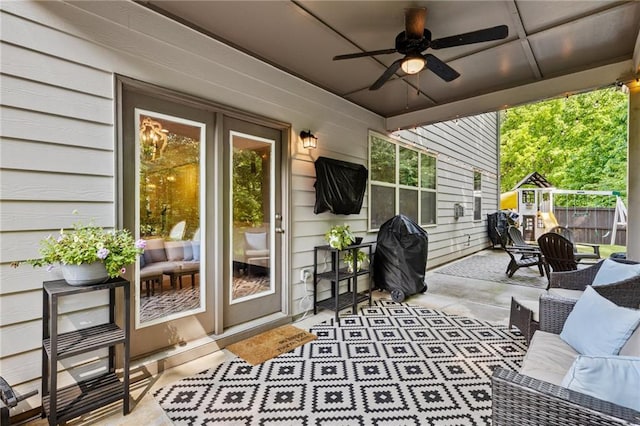 sunroom featuring ceiling fan