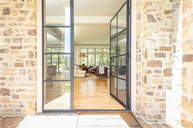 doorway to property with stone siding