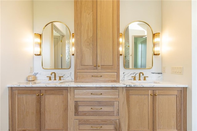 bathroom with double vanity and a sink