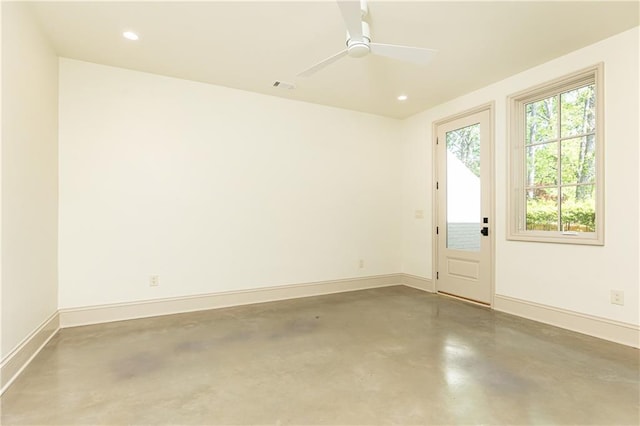 unfurnished room with concrete flooring, a ceiling fan, baseboards, recessed lighting, and visible vents