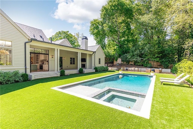 view of pool with a yard, an in ground hot tub, an outdoor living space, and a fenced in pool