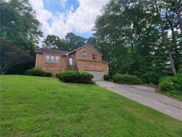 3723 Raiders Ridge Dr, Lithonia, GA 30038 - view of front of house featuring brick siding, concrete driveway, an attached garage, and a front yard