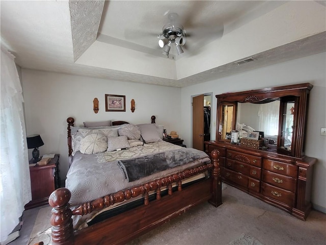 3723 Raiders Ridge Dr, Lithonia, GA 30038 - bedroom with carpet floors, a tray ceiling, and ceiling fan