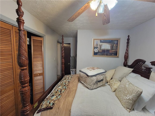 3723 Raiders Ridge Dr, Lithonia, GA 30038 - bedroom with a closet, ceiling fan, and a textured ceiling