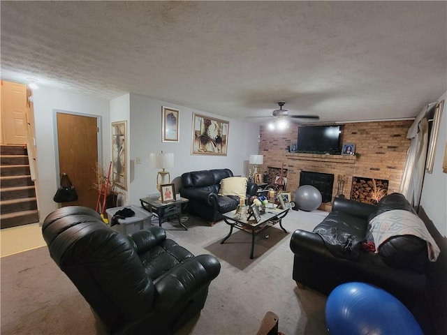 3723 Raiders Ridge Dr, Lithonia, GA 30038 - living room featuring carpet floors, ceiling fan, stairs, a textured ceiling, and a brick fireplace