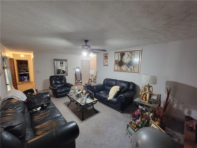 3723 Raiders Ridge Dr, Lithonia, GA 30038 - carpeted living area featuring ceiling fan and a textured ceiling
