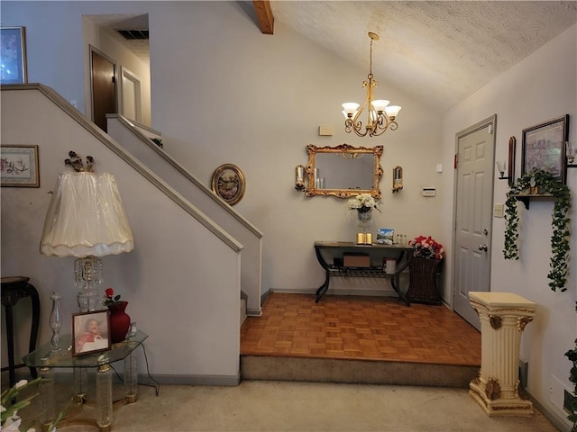 3723 Raiders Ridge Dr, Lithonia, GA 30038 - foyer featuring lofted ceiling, a chandelier, baseboards, a textured ceiling, and stairs