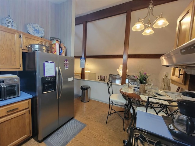 3723 Raiders Ridge Dr, Lithonia, GA 30038 - kitchen featuring stainless steel fridge with ice dispenser, light wood finished floors, and a chandelier
