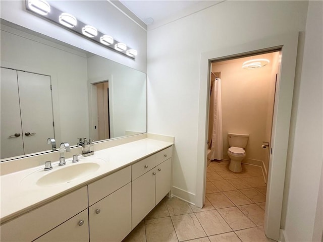 bathroom with a shower with shower curtain, ornamental molding, vanity, tile patterned flooring, and toilet