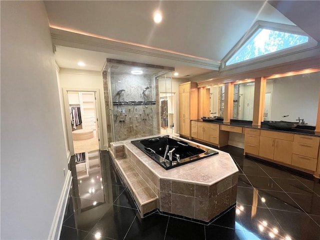 kitchen featuring light brown cabinets, a center island, and lofted ceiling