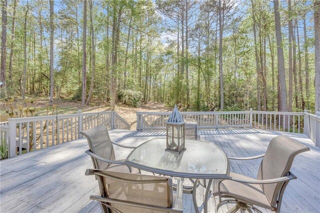 wooden deck with outdoor dining space