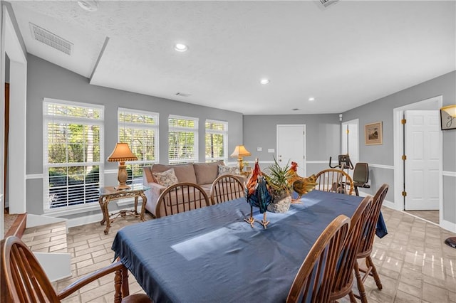 dining area with recessed lighting, visible vents, and baseboards