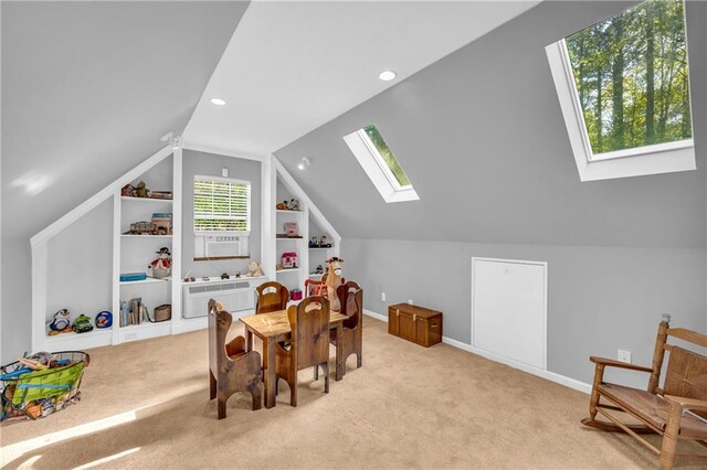 playroom featuring baseboards, built in features, recessed lighting, carpet flooring, and lofted ceiling with skylight