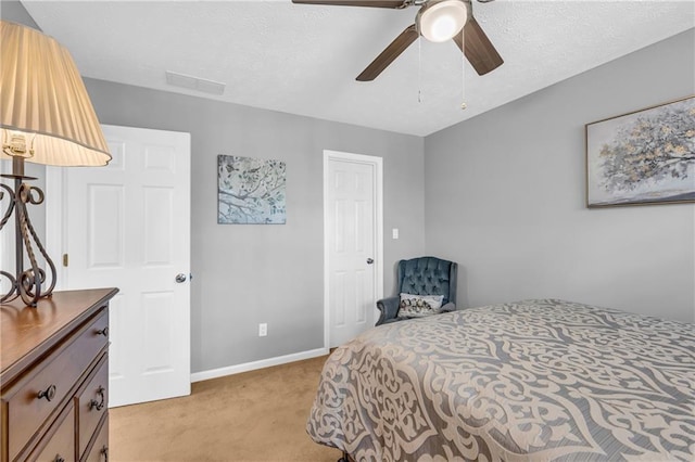 bedroom featuring light carpet, ceiling fan, baseboards, and visible vents