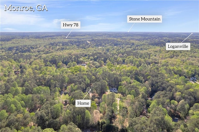 aerial view featuring a wooded view