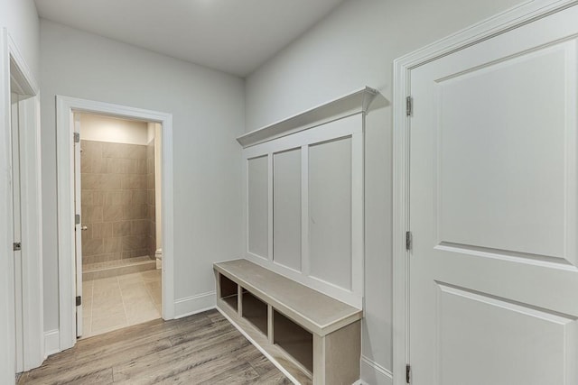 mudroom with light hardwood / wood-style flooring