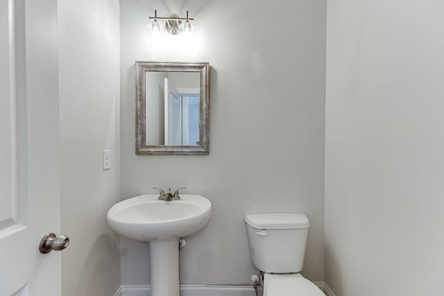 bathroom featuring toilet and sink