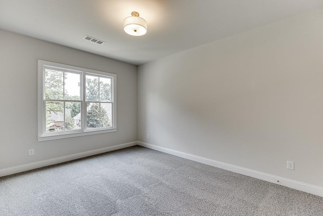 empty room featuring carpet floors