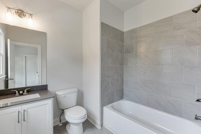 full bathroom featuring tiled shower / bath, tile patterned flooring, vanity, and toilet