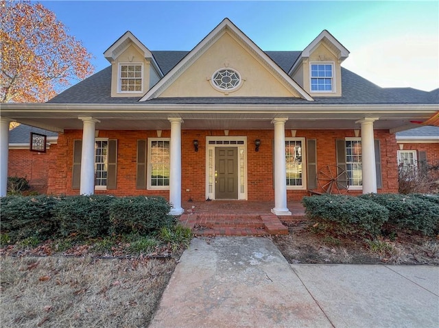 3212 Woodhaven Ct SW, Conyers, GA 30094 - view of front of house with brick siding, roof with shingles, and covered porch