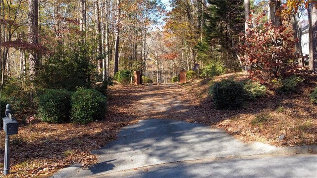 3212 Woodhaven Ct SW, Conyers, GA 30094 - view of street with a forest view