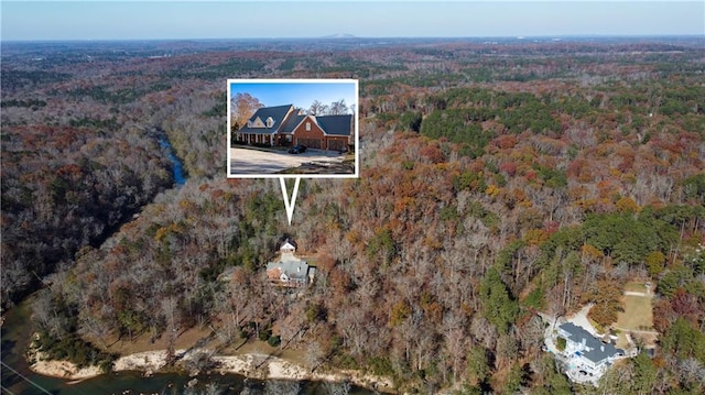 3212 Woodhaven Ct SW, Conyers, GA 30094 - birds eye view of property featuring a forest view
