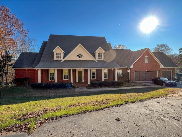 3212 Woodhaven Ct SW, Conyers, GA 30094 - view of front of property with an attached garage, brick siding, a front yard, covered porch, and driveway