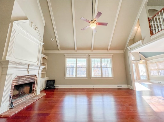 3212 Woodhaven Ct SW, Conyers, GA 30094 - unfurnished living room with a ceiling fan, beam ceiling, and wood finished floors