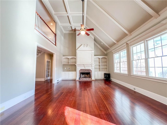 3212 Woodhaven Ct SW, Conyers, GA 30094 - unfurnished living room with high vaulted ceiling, beamed ceiling, a ceiling fan, and hardwood / wood-style floors