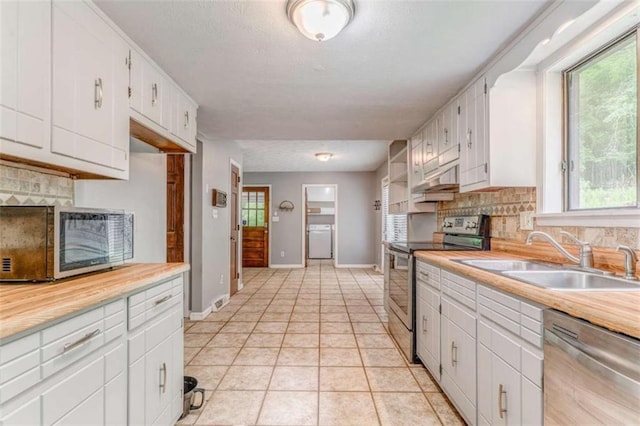 227 Margo Trl, Rome, GA 30161 - kitchen with appliances with stainless steel finishes, a sink, decorative backsplash, and healthy amount of natural light