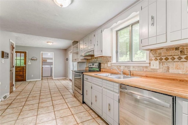 227 Margo Trl, Rome, GA 30161 - kitchen with appliances with stainless steel finishes, a sink, under cabinet range hood, backsplash, and light countertops