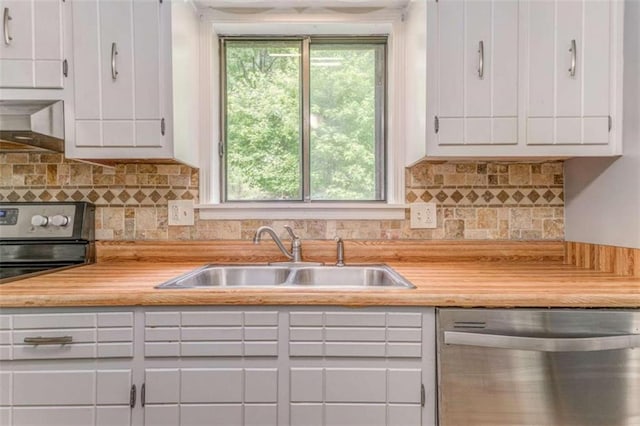 227 Margo Trl, Rome, GA 30161 - kitchen with a sink, stainless steel appliances, white cabinetry, and decorative backsplash