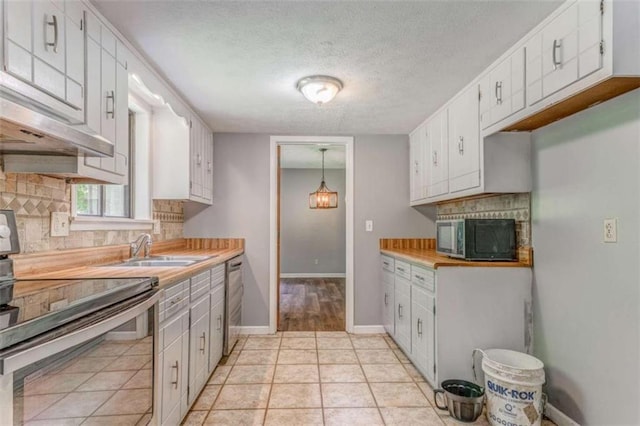 227 Margo Trl, Rome, GA 30161 - kitchen featuring appliances with stainless steel finishes, a sink, tasteful backsplash, a textured ceiling, and light countertops