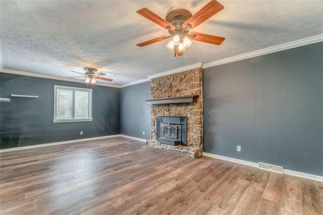 227 Margo Trl, Rome, GA 30161 - unfurnished living room with ceiling fan, a textured ceiling, wood finished floors, ornamental molding, and baseboards