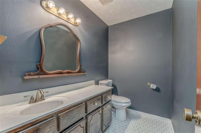 227 Margo Trl, Rome, GA 30161 - bathroom with toilet, vanity, tile patterned floors, and baseboards
