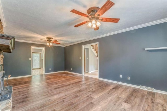 227 Margo Trl, Rome, GA 30161 - unfurnished living room with ceiling fan, stairs, wood finished floors, baseboards, and ornamental molding