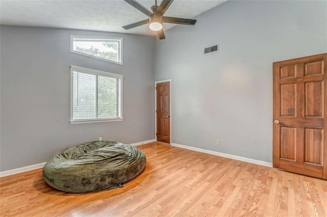 227 Margo Trl, Rome, GA 30161 - empty room featuring high vaulted ceiling, wood finished floors, baseboards, and a ceiling fan