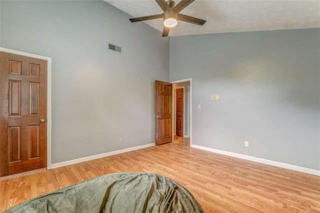227 Margo Trl, Rome, GA 30161 - unfurnished bedroom featuring high vaulted ceiling, baseboards, light wood-type flooring, and a ceiling fan